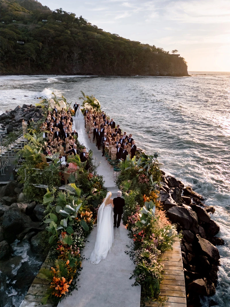 Luxury beachfront wedding ceremony aisle design in Los Cabos