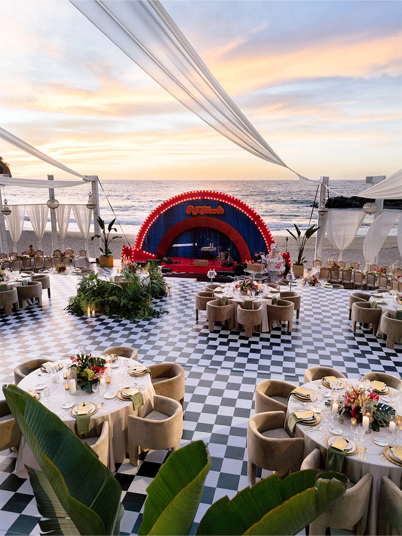 Floral wedding arch installation on the beach
