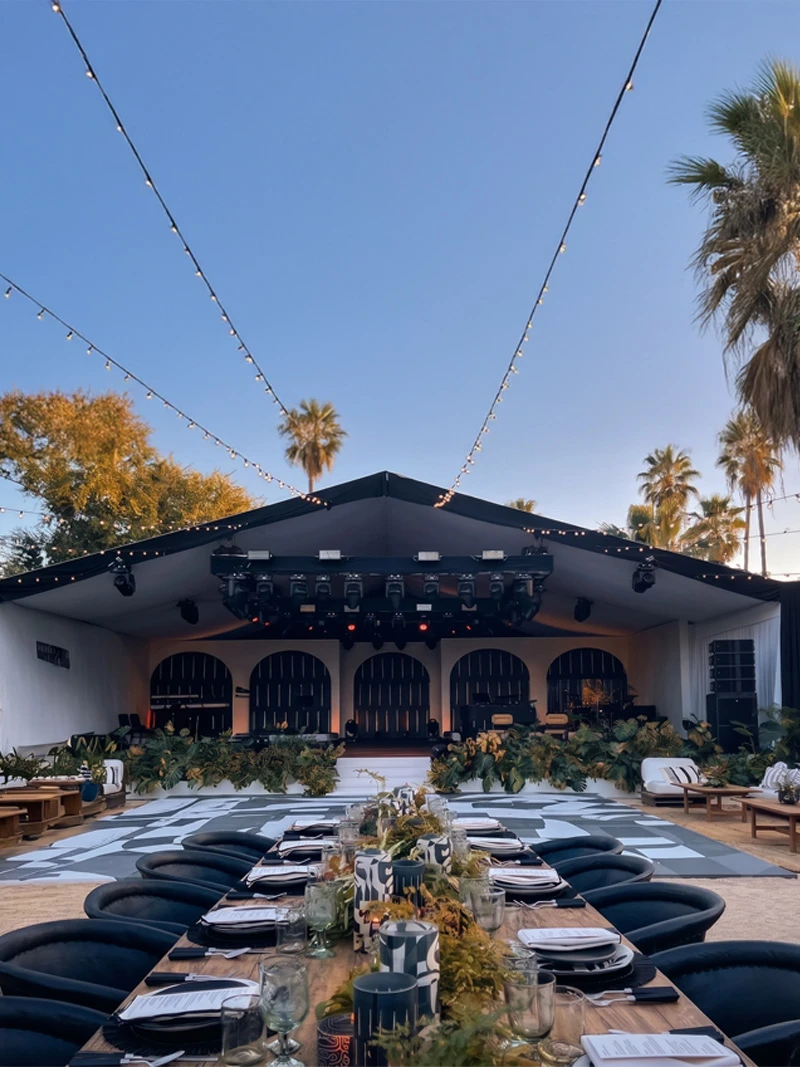 Complex structural venue transformation and premium tent setups on the beach